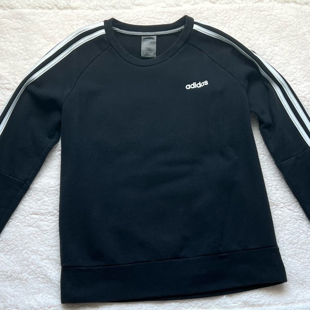 Adidas sweatshirt black with three white strips on both sleeves.